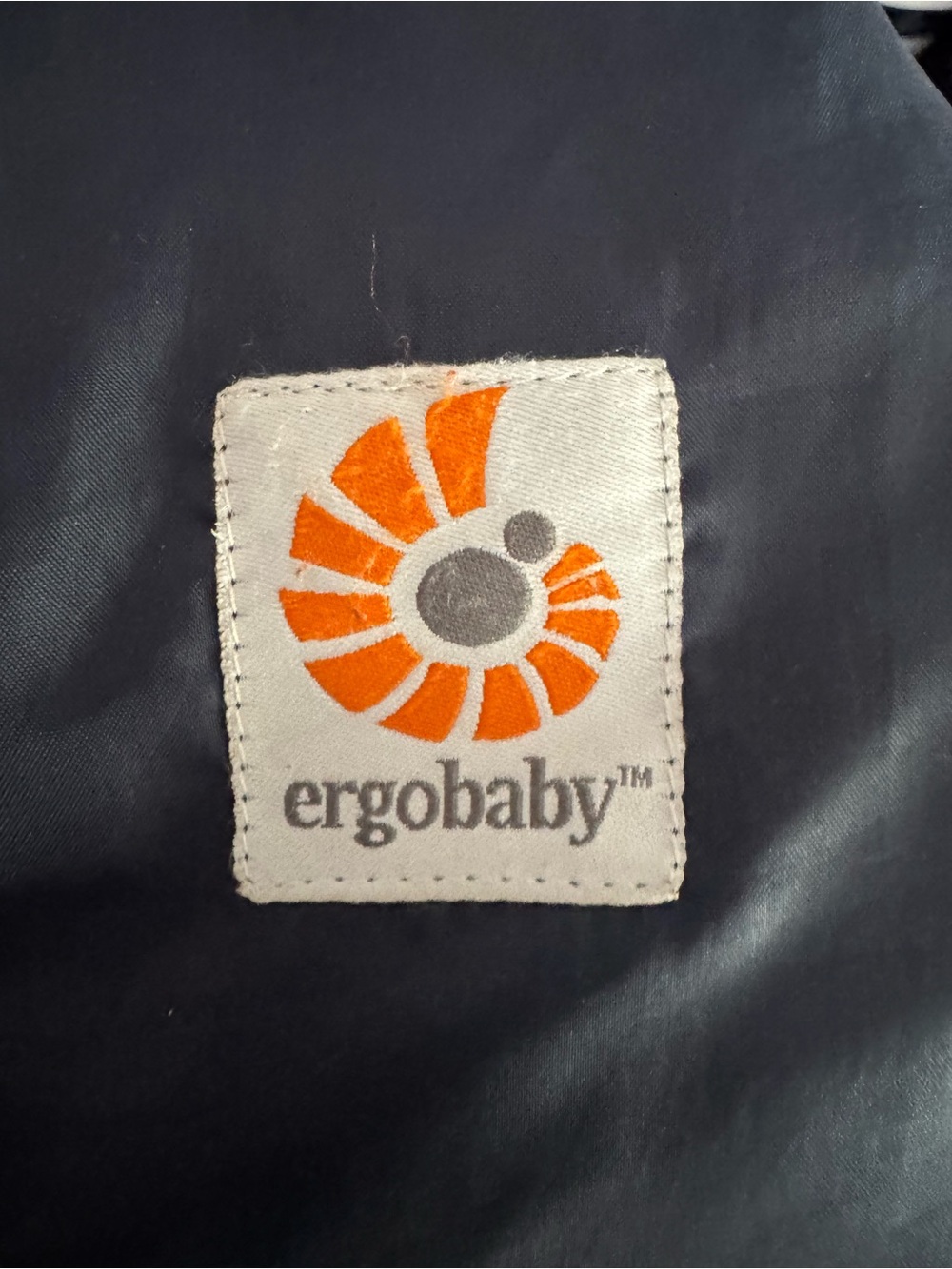 Ergobaby Patch with Orange Spiral and Gray Text